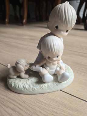 Precious Moments  "Baby's First Pet" Figurine